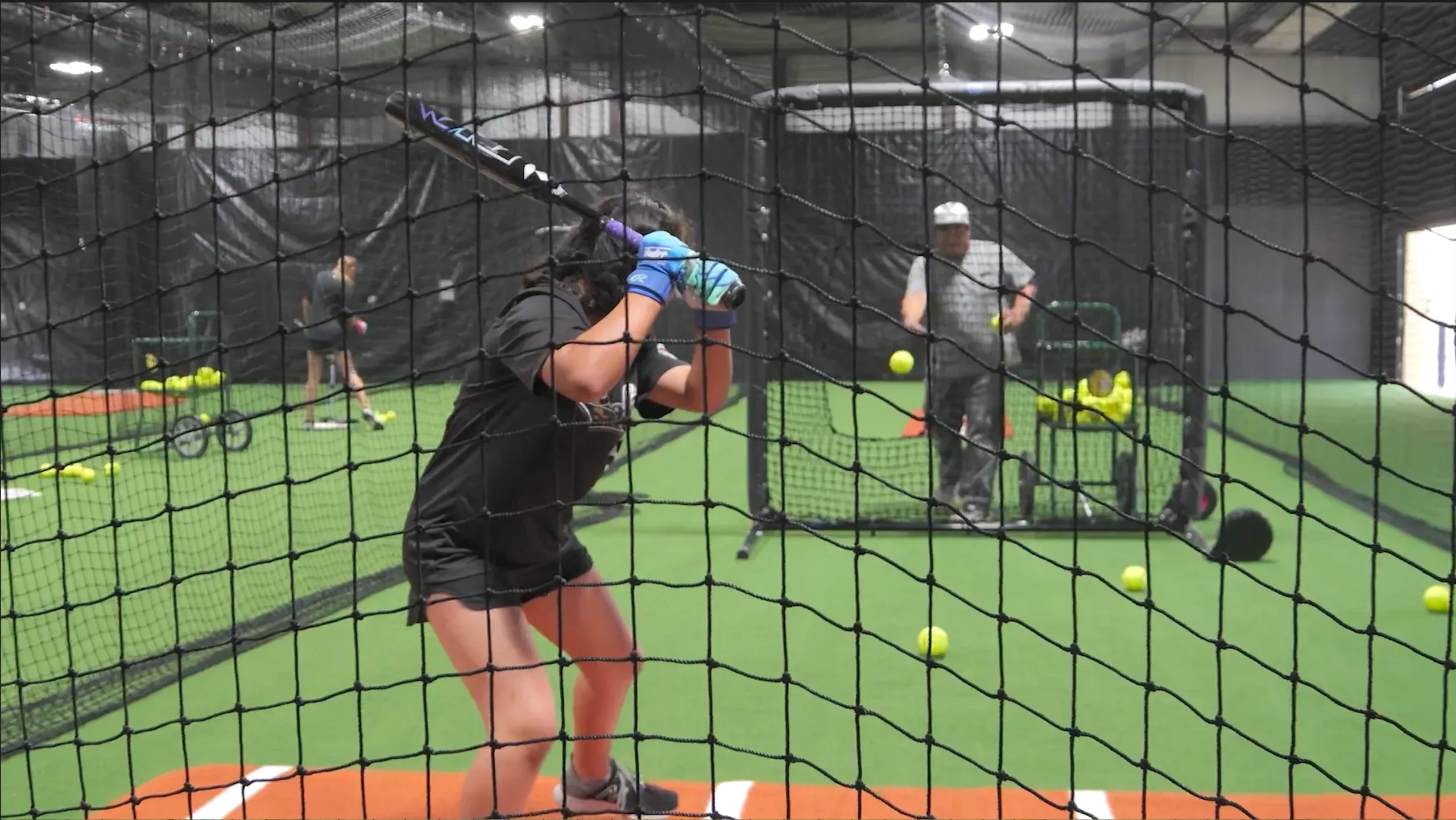 A player working in a Flatland batting cage